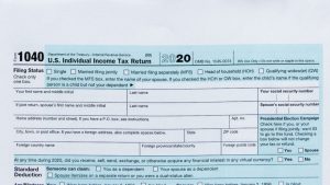 Tax Form on Black Surface | Breast Cancer Car Donations