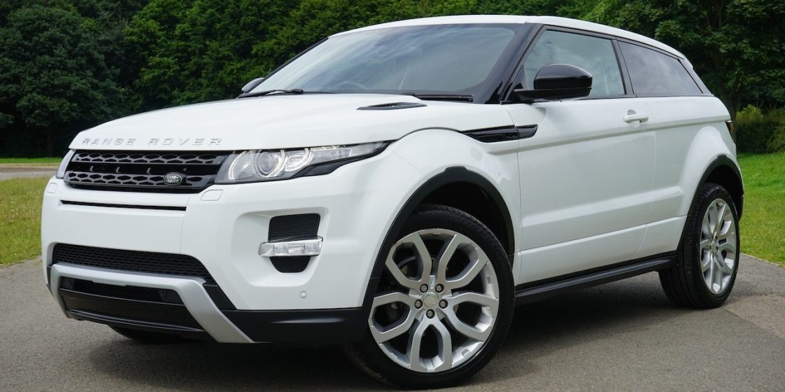 White Land Rover Range Rover Suv on Road | Breast Cancer Car Donations