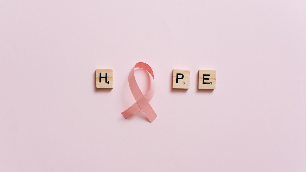 A Pink Ribbon on a Pink Surface with Message | Breast Cancer Car Donations