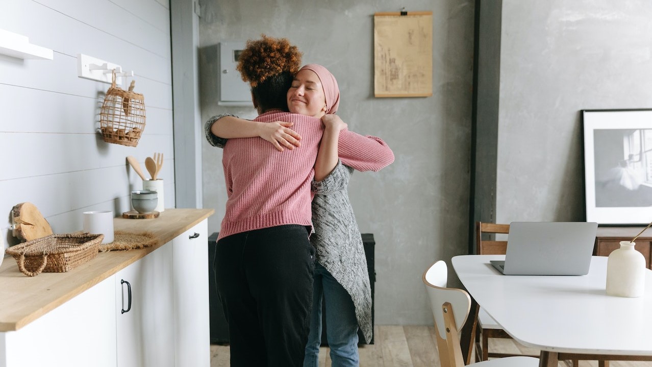 A Woman Hugging her Friend | Breast Cancer Car Donations