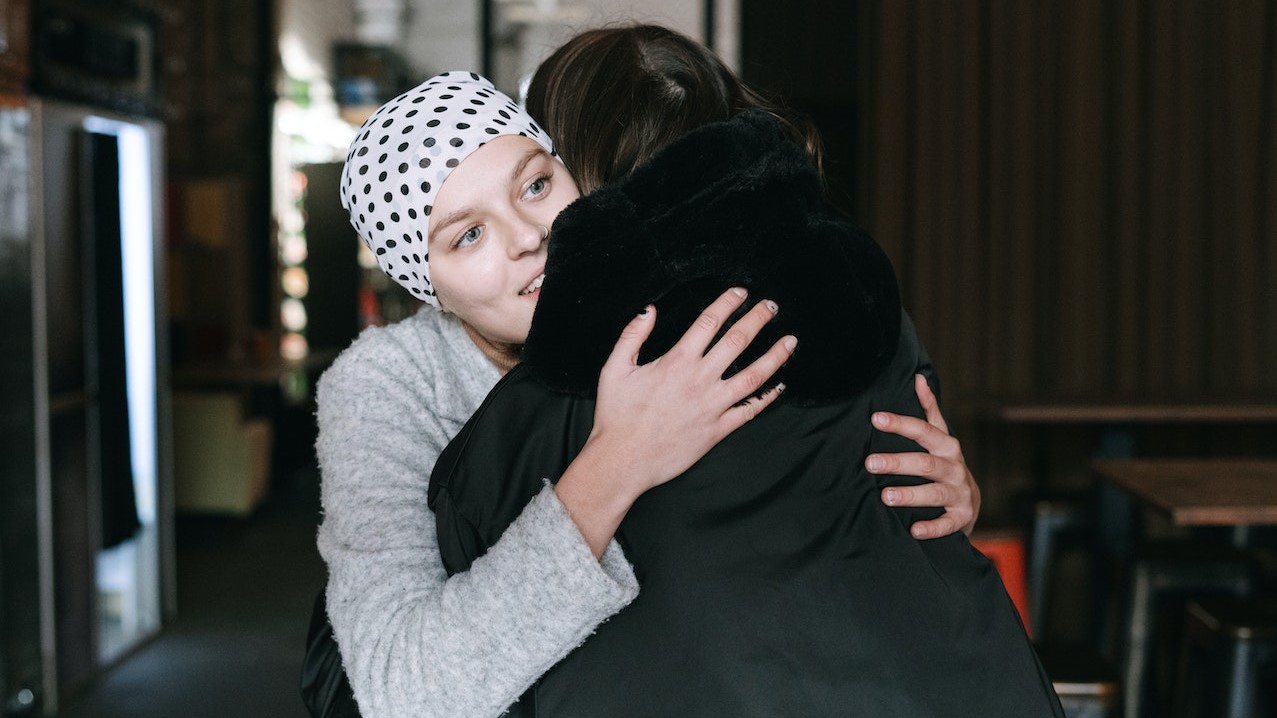 Close-Up Shot of Two People Hugging Each Other | Breast Cancer Car Donations