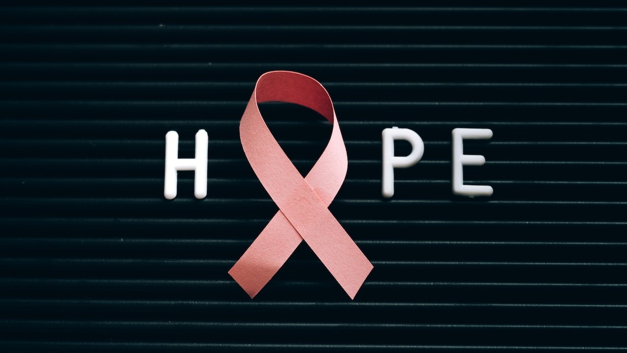 A Pink Ribbon on a Letter Board with Message | Breast Cancer Car Donations