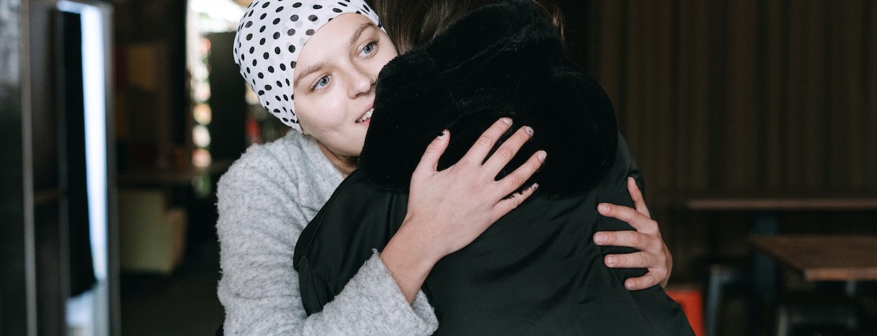 Close-Up Shot of Two People Hugging Each Other | Breast Cancer Car Donations