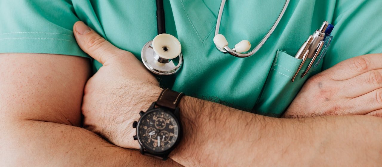 Crop unrecognizable male doctor with stethoscope | Breast Cancer Car Donations