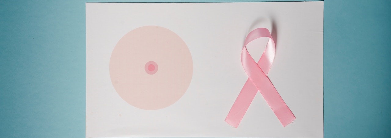 Pink Ribbon On Top Of A Paper | Breast Cancer Car Donations