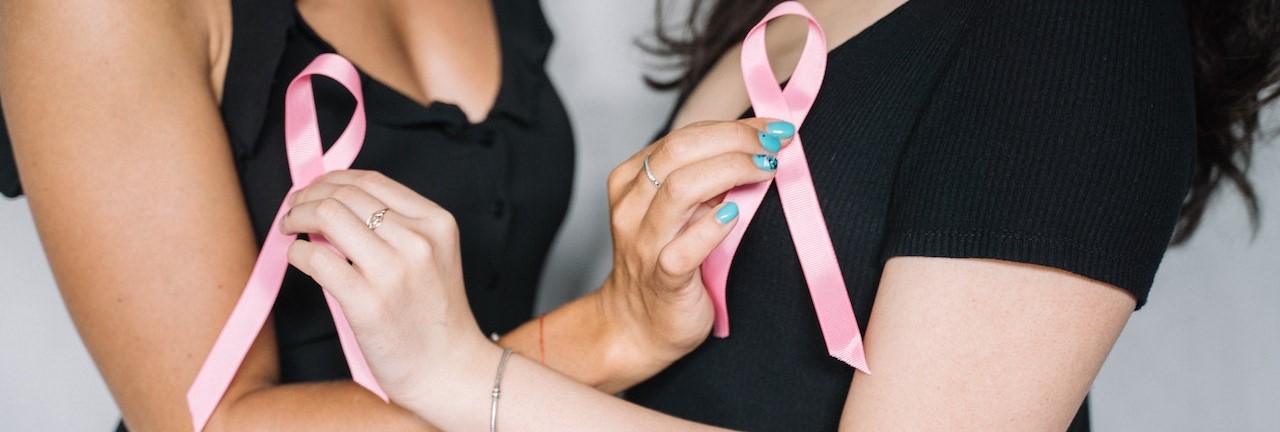 2 Women Holding Pink Ribbons | Breast Cancer Car Donations