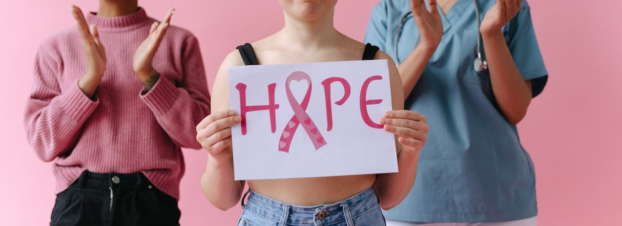 Young Women Smiling and Clapping Their Hands | Breast Cancer Car Donations