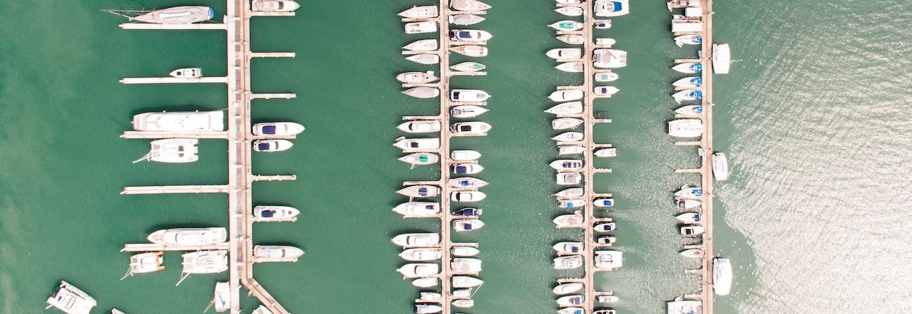 Aerial View of Boats on Dock | Breast Cancer Car Donations