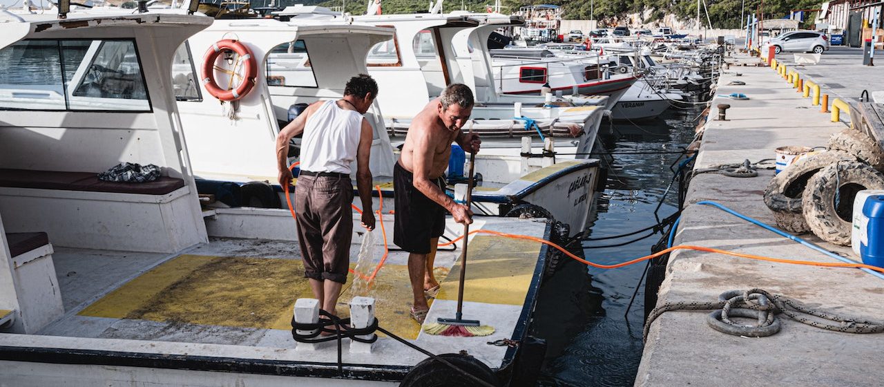 Men Cleaning the Boat Deck | Breast Cancer Car Donations