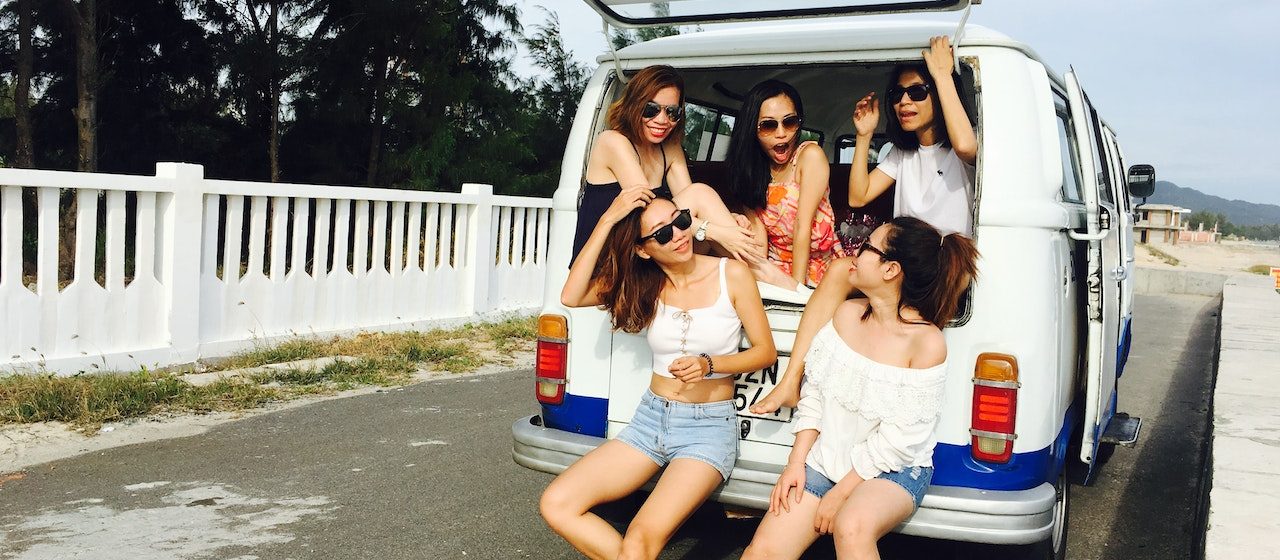 Photo of Five Women Sitting in Back of Van | Breast Cancer Car Donations