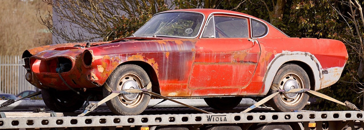 Red Coupe on Flatbed Trailerr | Breast Cancer Car Donations