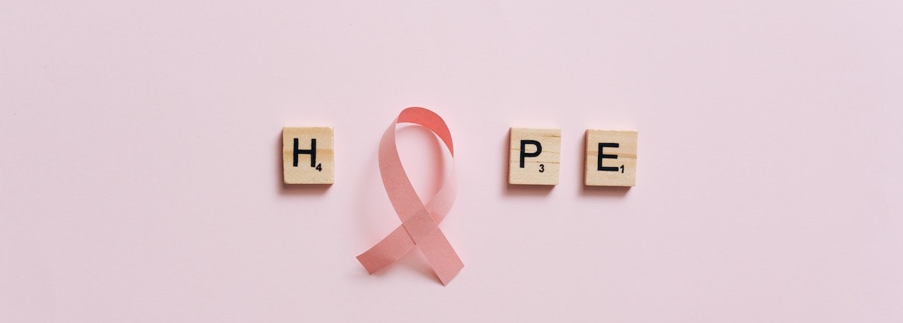 A Pink Ribbon on a Pink Surface with Message | Breast Cancer Car Donations