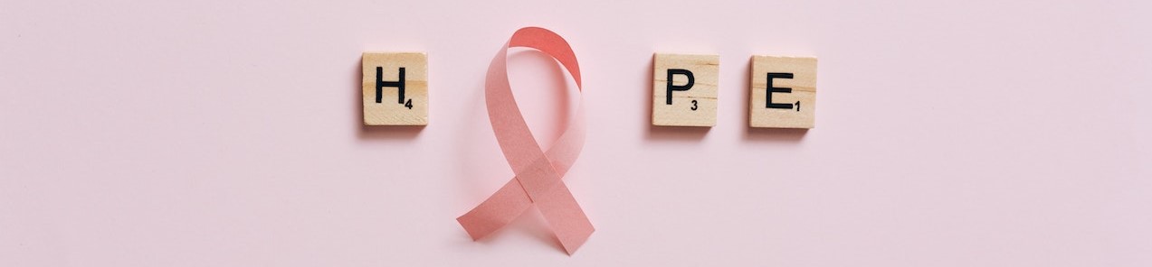 A Pink Ribbon on a Pink Surface with Message | Breast Cancer Car Donations