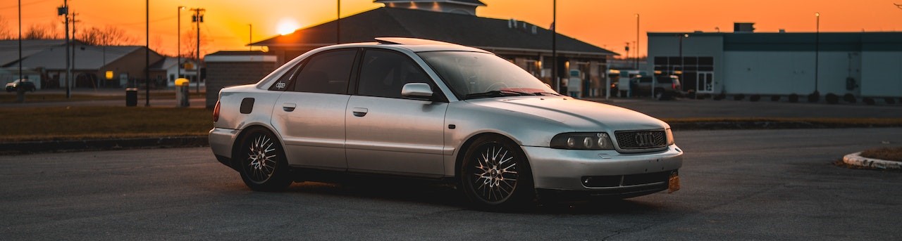 A Silver Sedan Car Parked on the Road during Sunset | Breast Cancer Car Donations