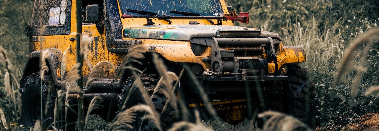 A Yellow SUV on the Dirt Road | Breast Cancer Car Donations