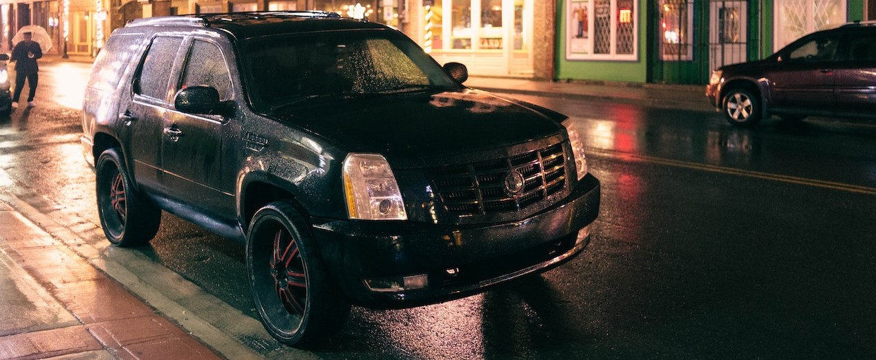 Black Car Parked in the Street | Breast Cancer Car Donations