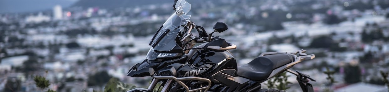 Black Motorcycle Parked on Gray Concrete Road | Breast Cancer Car Donations