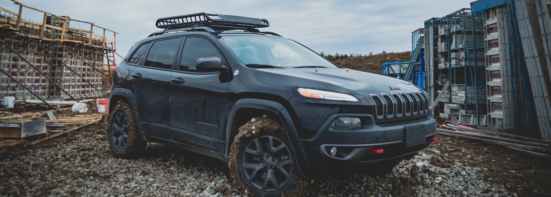 Black muddy SUV | Breast Cancer Car Donations