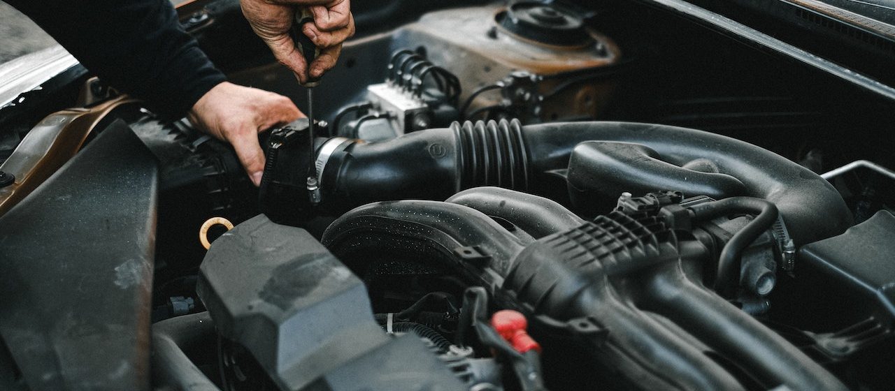 Checking the Engine of a Car | Breast Cancer Car Donations