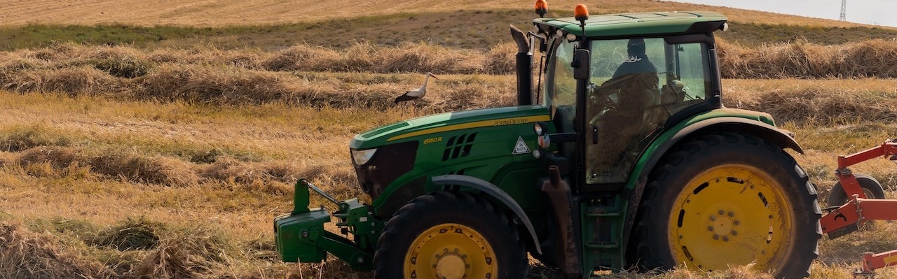 Green Tractor on Hayfield | Breast Cancer Car Donations