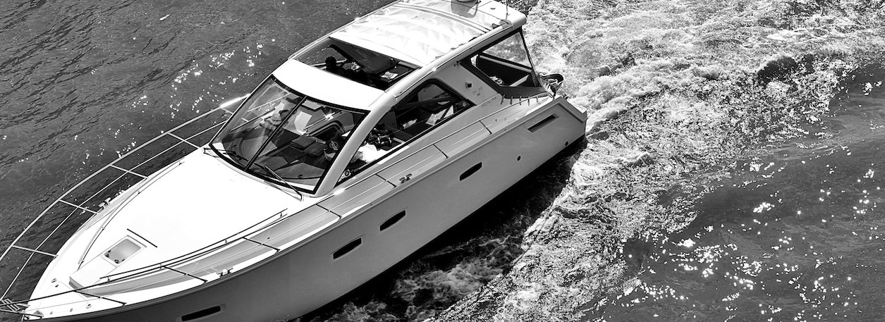 Greyscale photo of yatch | Breast Cancer Car Donations