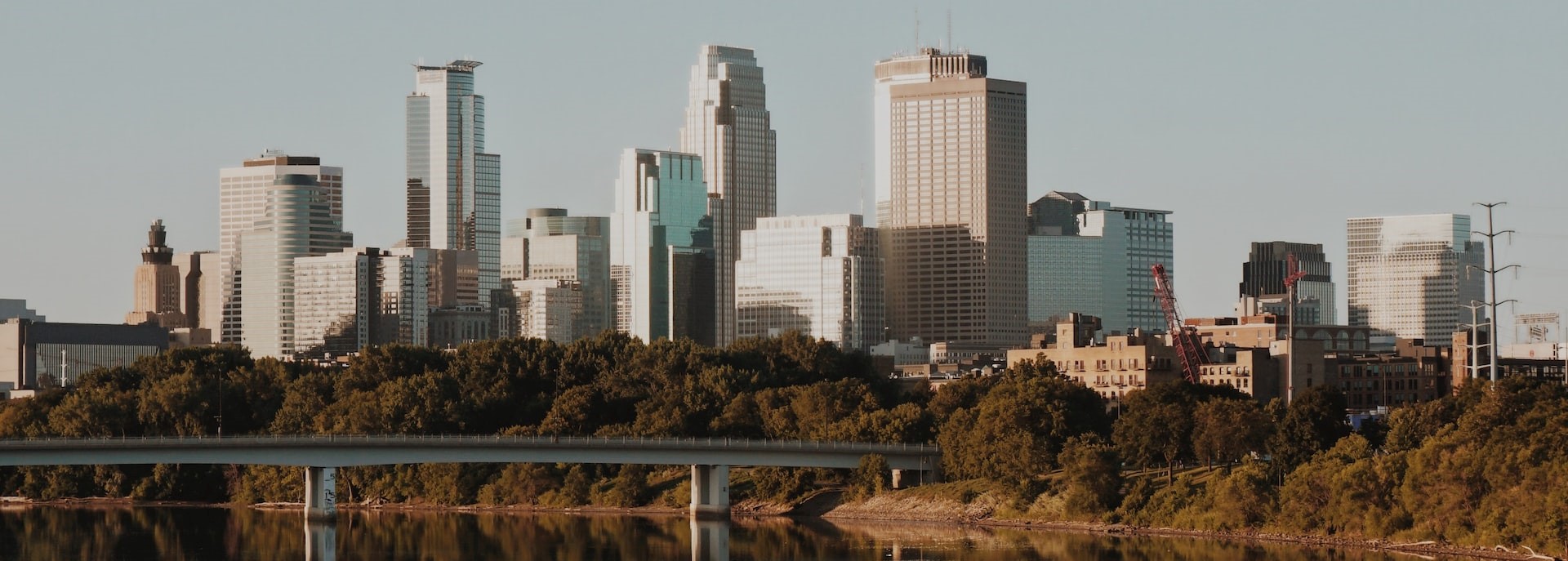 Minneapolis skyline reflecting off the Mississippi River | Breast Cancer Car Donations