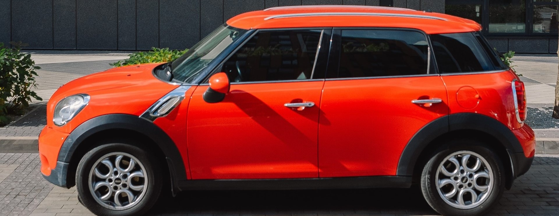 Orange Car Beside the wall | Breast Cancer Car Donations