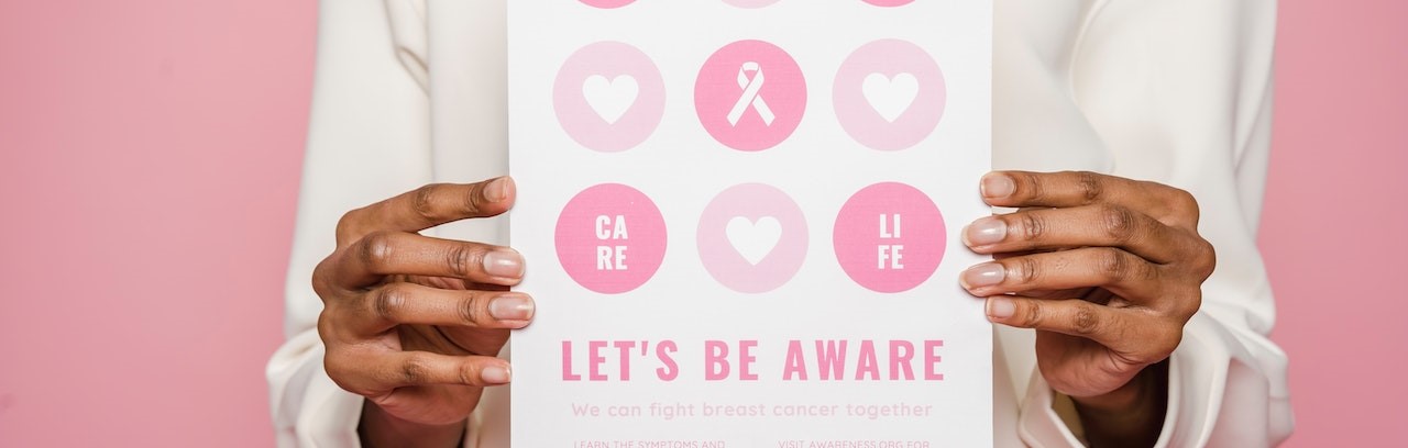 Person Holding A Poster | Breast Cancer Car Donations 