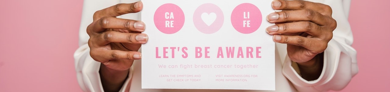Person Holding A Poster | Breast Cancer Car Donations