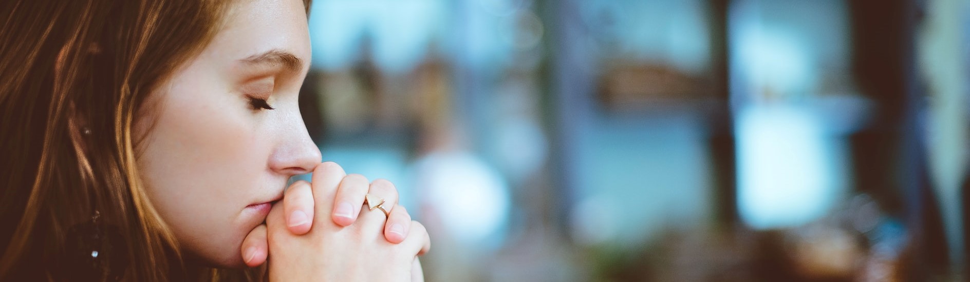 Photo of a girl praying | Breast Cancer Car Donations