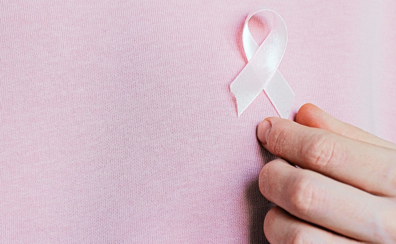 Pink Ribbon With Hand | Breast Cancer Car Donations