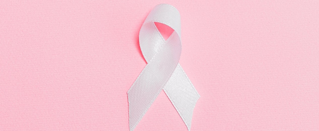 Pink Ribbon on Pink Surface | Breast Cancer Car Donations