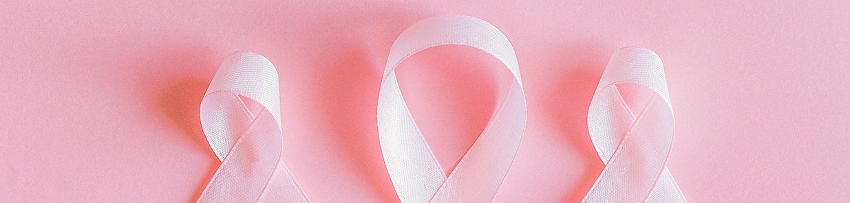 Pink Ribbons on Pink Surface | Breast Cancer Car Donations