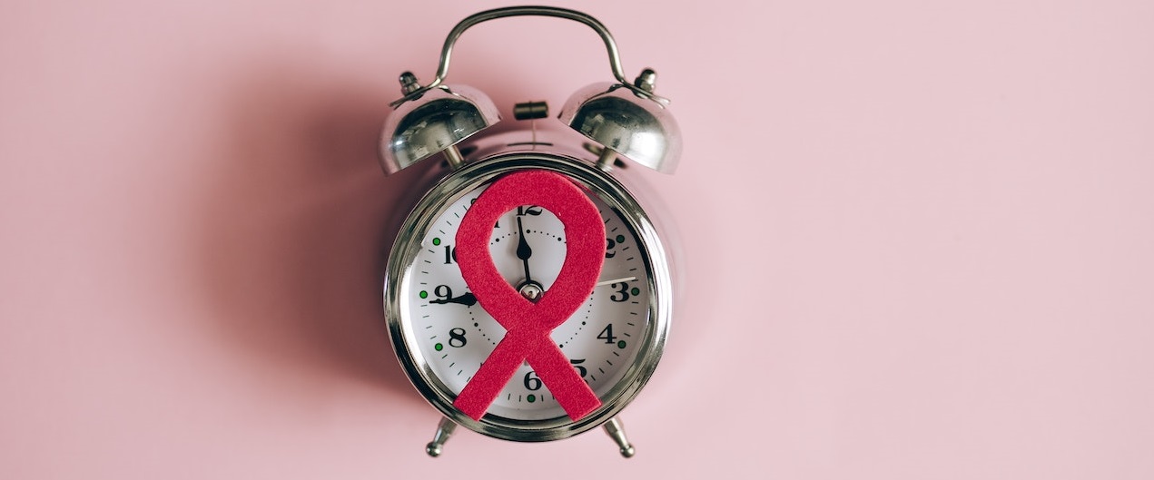 Pink ribbon on clock | Breast Cancer Car Donations