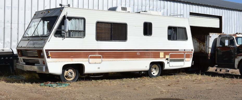 RV parked outside with another car | Breast Cancer Car Donations