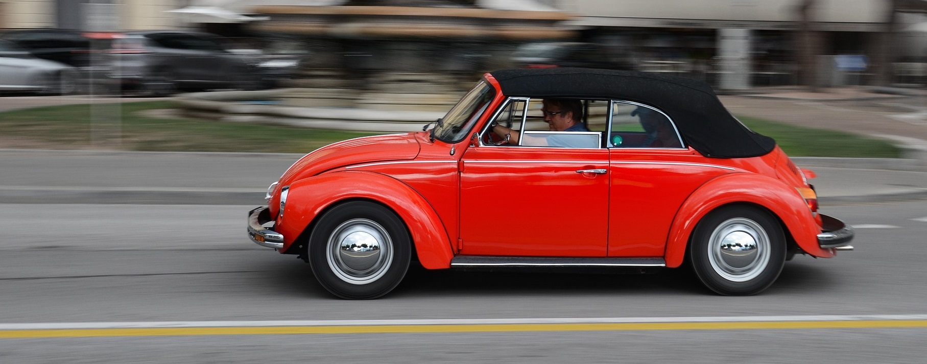 Red Bettle running on road | Breast Cancer Car Donations