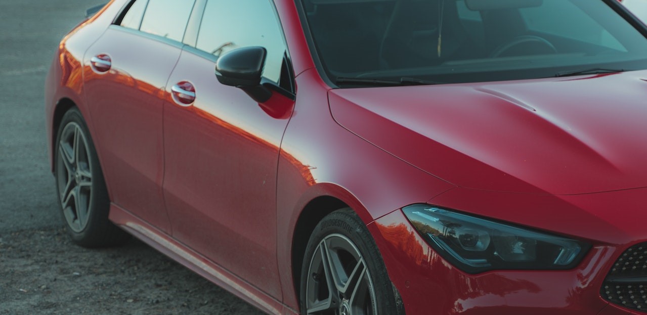 Red Car Parked on the Parking Area | Breast Cancer Car Donations