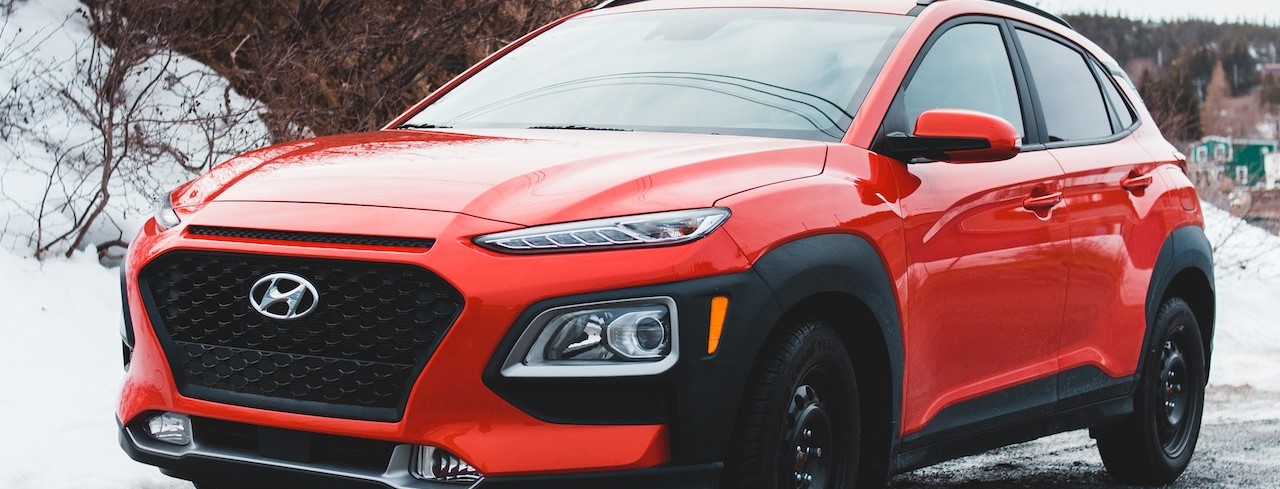 Red Hyundai Parked on Gray Concrete Pavement | Breast Cancer Car Donations