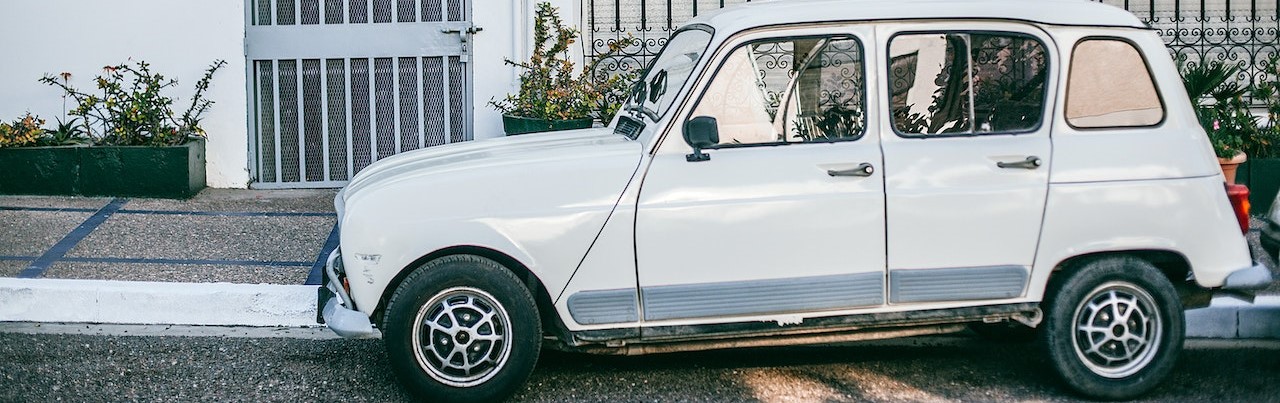 Retro car parked near asphalt | Breast Cancer Car Donations