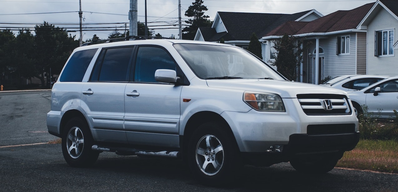 Silver SUV parked | Breast Cancer Car Donations