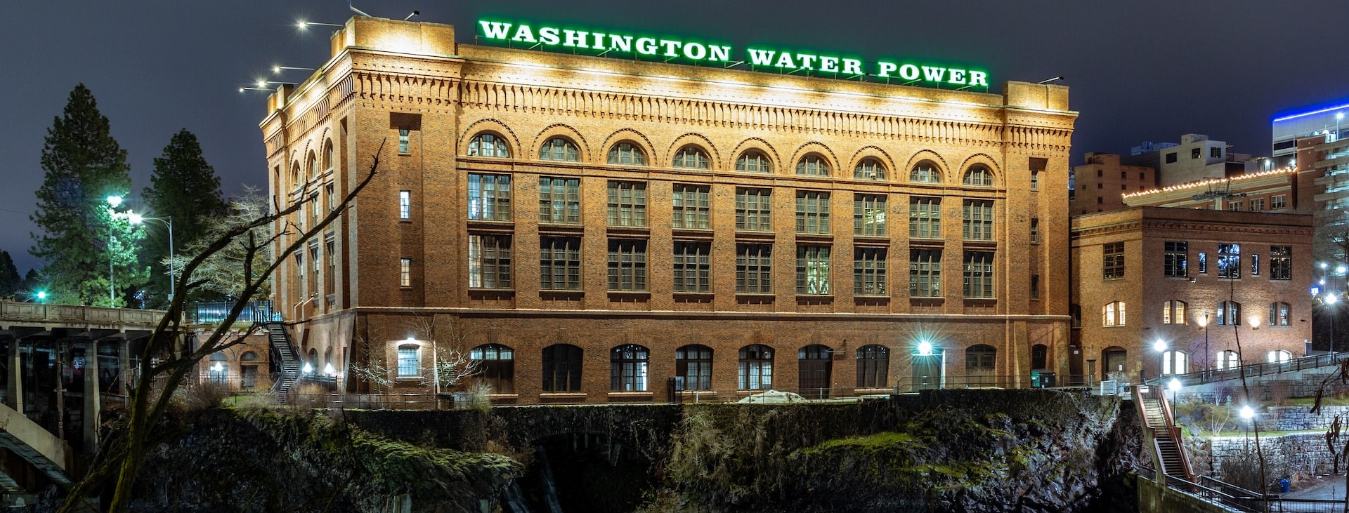 The Washington Water Power Building at night in Spokane WA | Breast Cancer Car Donations