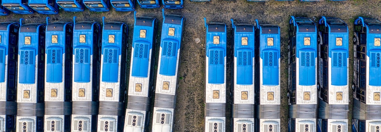 Top view of a blue buses parked | Breast Cancer Car Donations