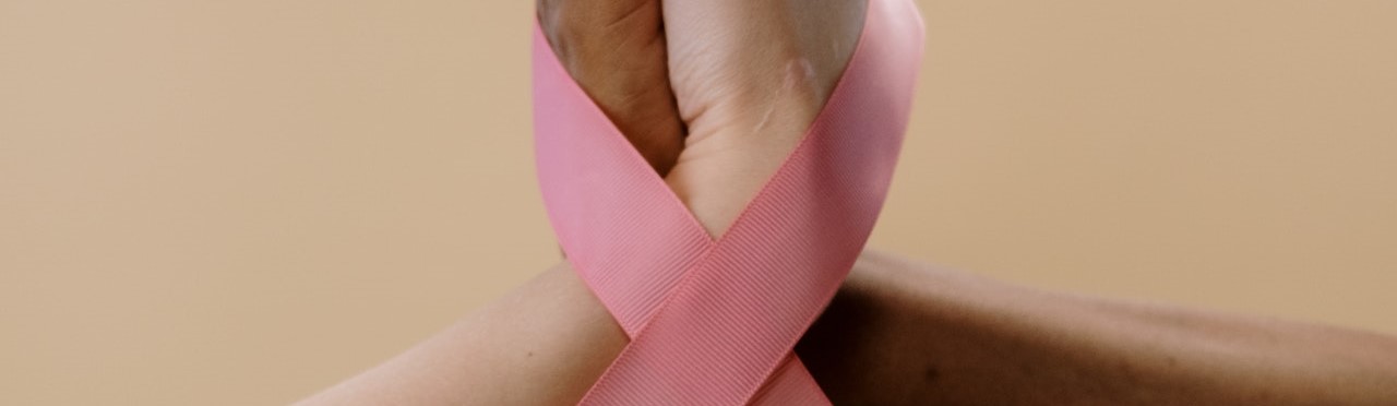 Two People Holding their Hands with Pink Ribbon | Breast Cancer Car Donatins
