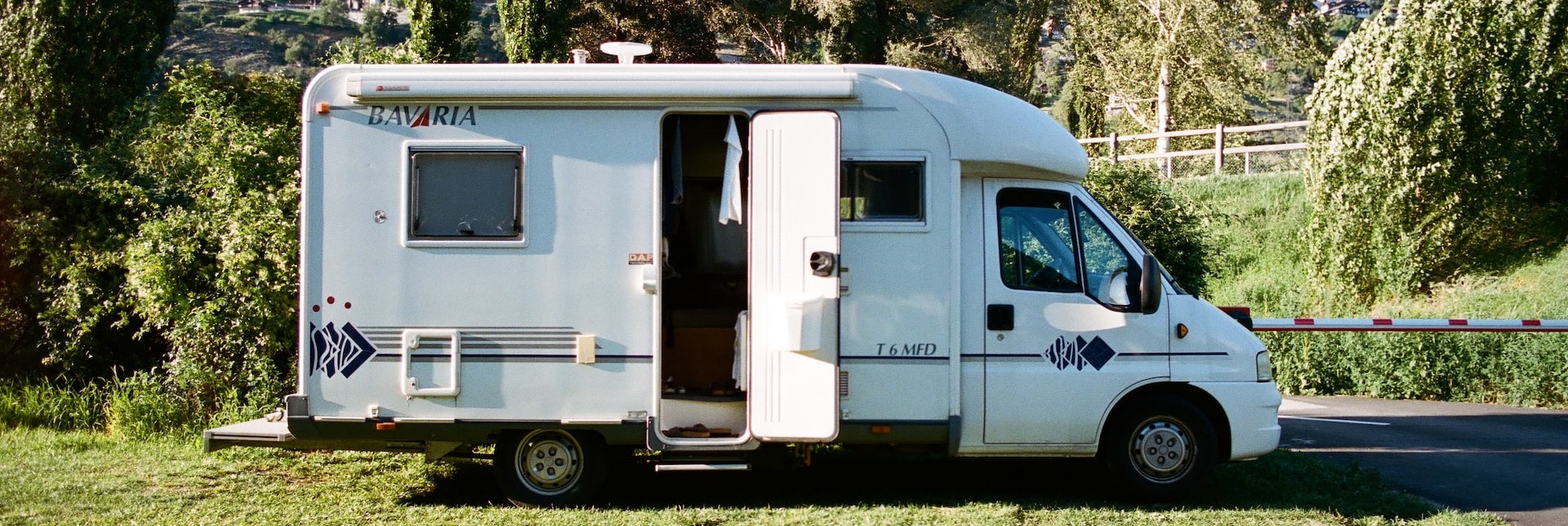 White RV Parked on the grass | Breast Cancer Car Donations