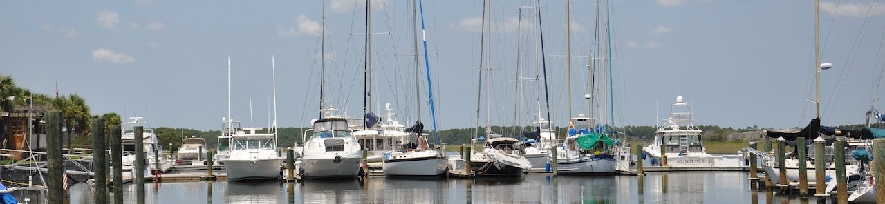 White Sail Boats on Body of Water | Breast Cancer Car Donations