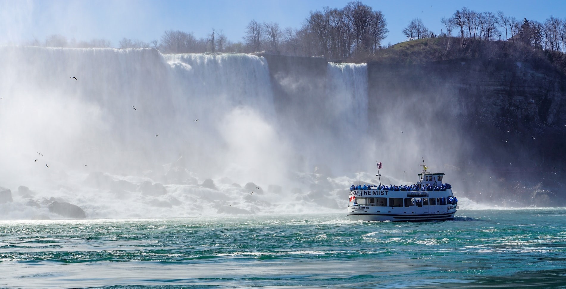 White and Blue Boat on Water Falls | Breast Cancer Car Donations