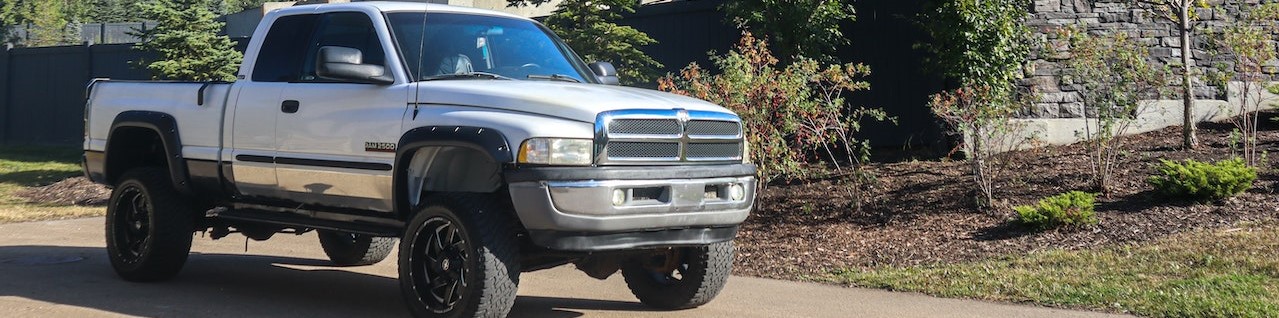 White pickup truck parked | Breast Cancer Car Donations