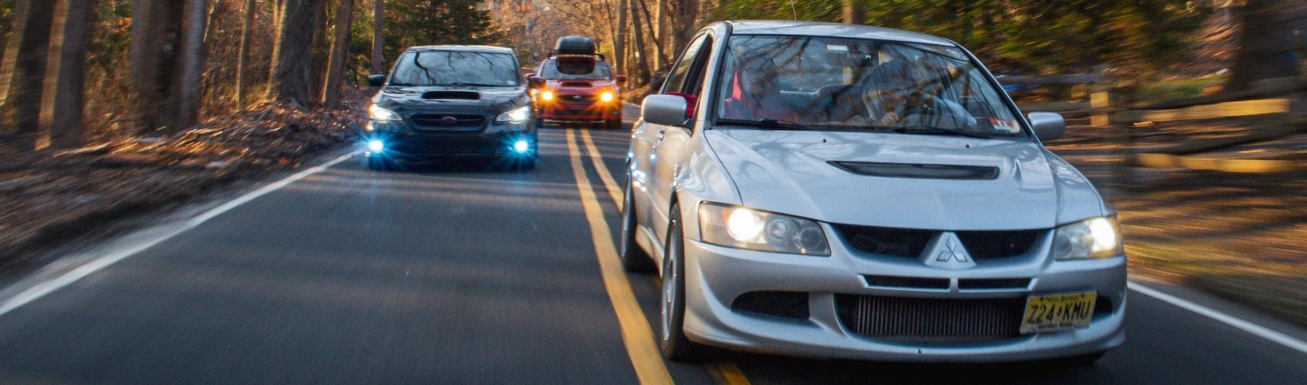 three cars on forest road | Breast Cancer Car Donations