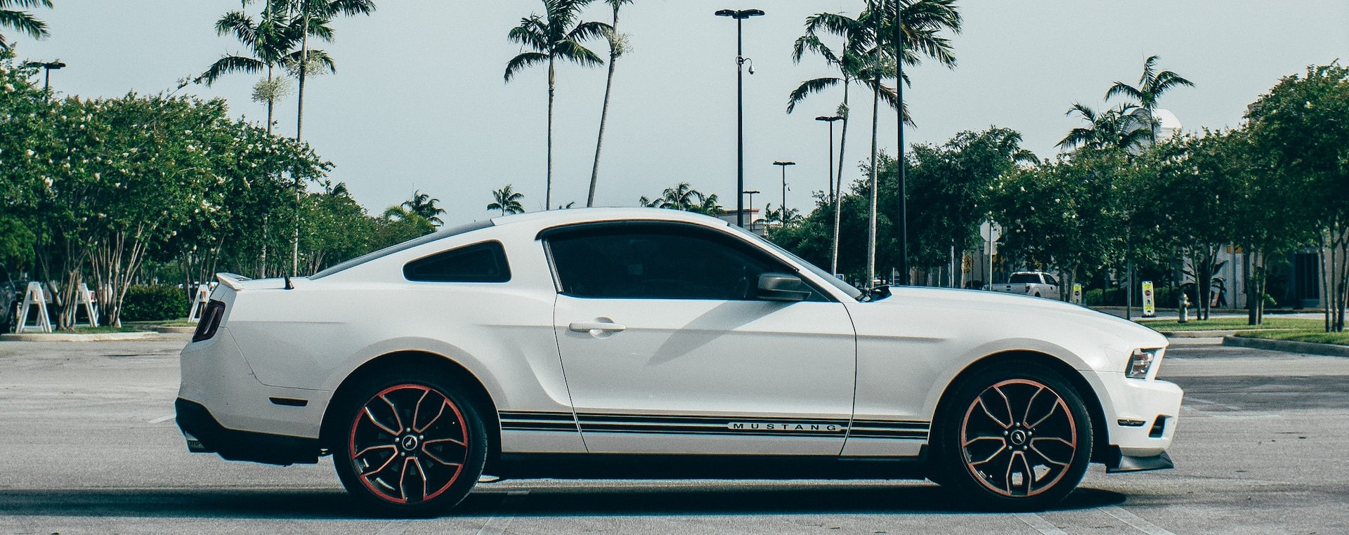 white coupe on gray asphalt road | Breast Cancer Car Donations