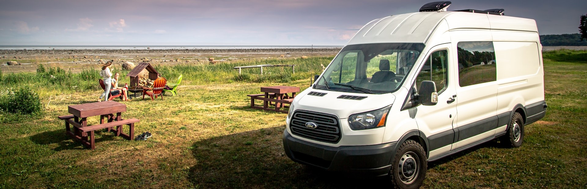 white van on a green grass field | Breast Cancer Car Donations